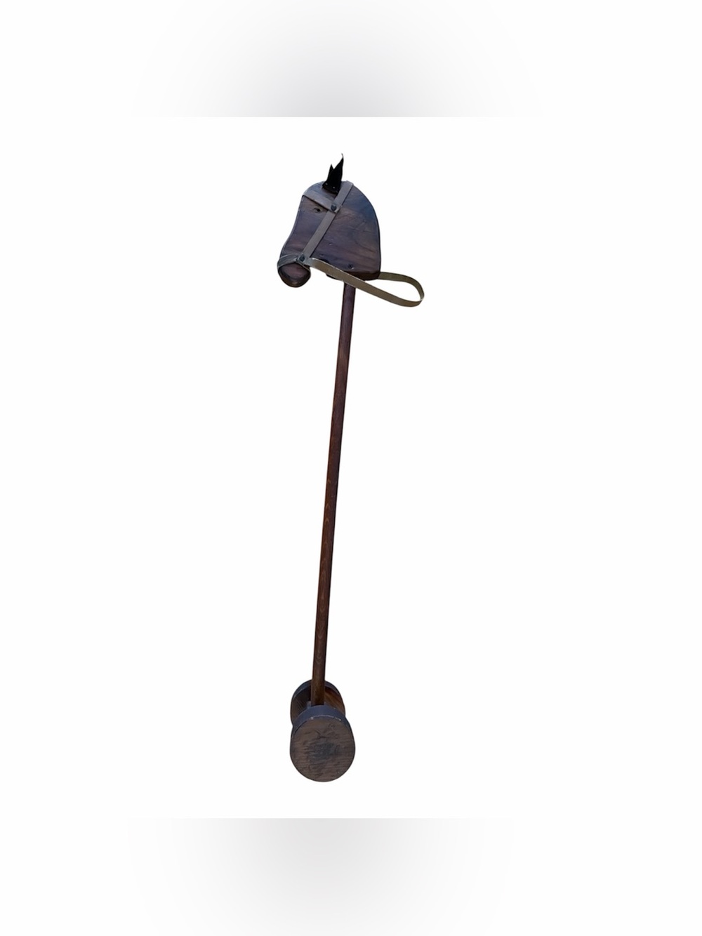 vintage carved wooden hobby horse featuring a wooden head and wheels.